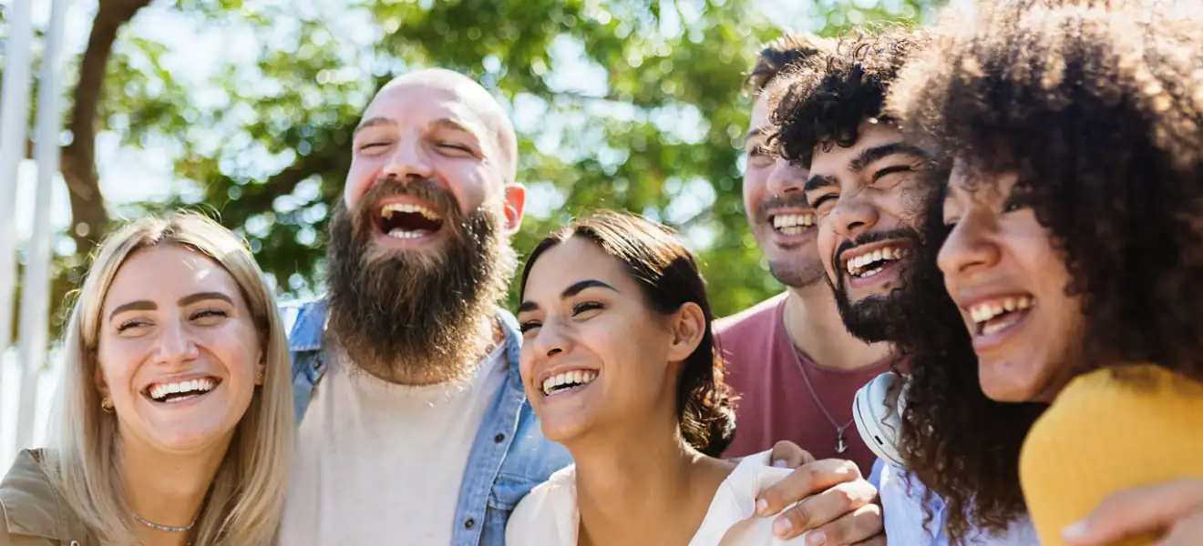 Young group of diverse friends having fun in a sunny day